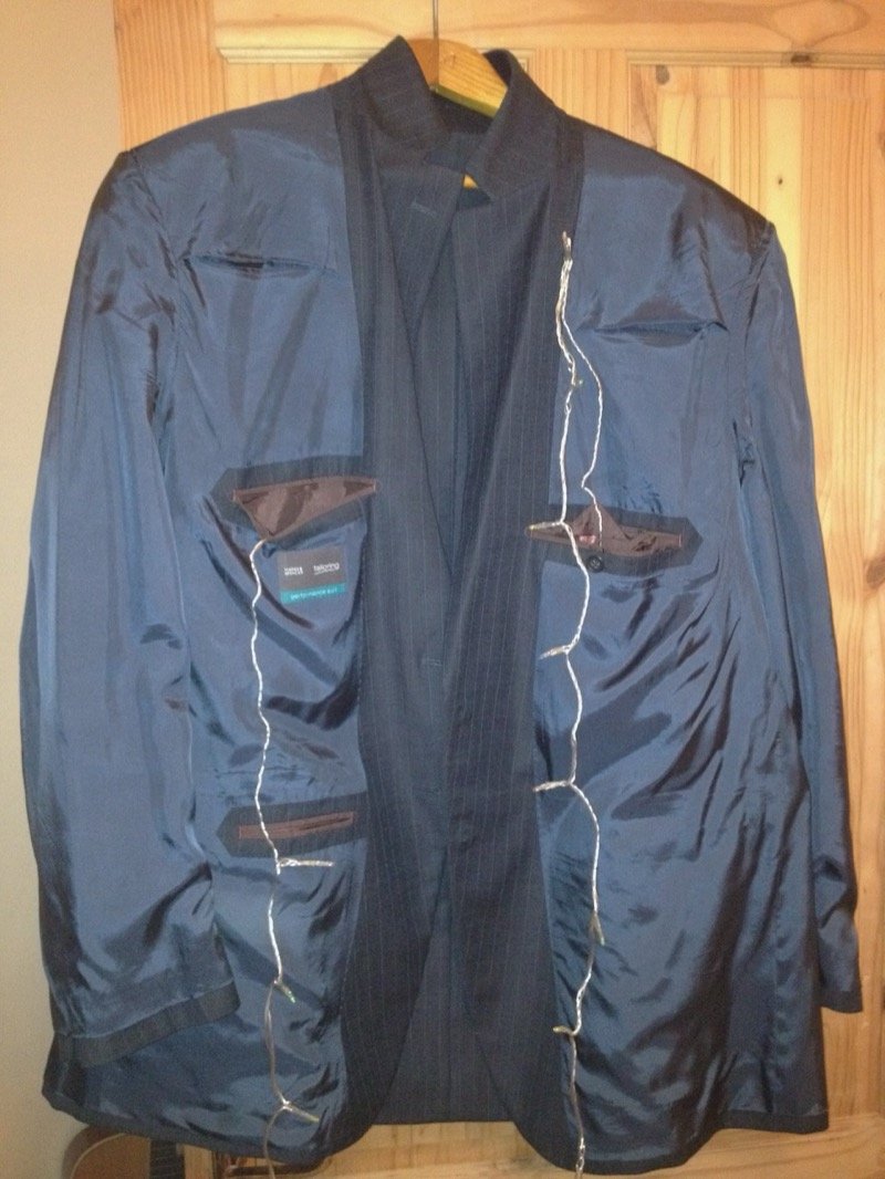 The inner wiring — battery packs, safety pins, and LED strings